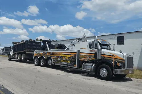 Universal Towing heavy wrecker recovering semi truck